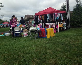 Neighbors | Alexis Bartolomucci.Tents that were set up sold clothing, toys and other items for children at the Baby Bargain Boutique sale at Boardman Park on Sept. 24.