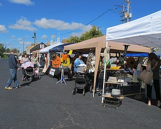 Neighbors | Alexis Bartolomucci.People checked out all of the vendors at the monthly Youngstown flea market at Freeman Alley on Sept. 24.