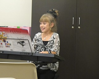 Neighbors | Alexis Bartolomucci.One of the children at the Boardman library on Sept. 21 played songs on the piano for the annual Boardman library talent show.