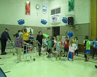 Neighbors | Alexis Bartolomucci.Poland Union students and residents from Sunrise Assisted Living cheered each other on as they finished the relay race on Sept. 21.