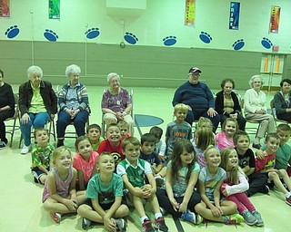 Neighbors | Alexis Bartolomucci.Alice Colella's first-grade class sat with the residents from Sunrise Assisted Living who visited them at school on Sept. 21.