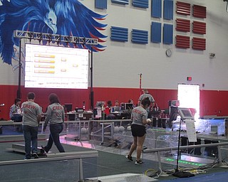 Neighbors | Alexis Bartolomucci.Volunteers worked as crew members on Sept. 25 to help with the Mahoning Valley FIRST Robotics Competition charity food drive at Austintown Middle School.