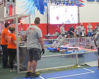 Neighbors | Alexis Bartolomucci.Robotics teams battled against each other during the FIRST Robotics Competition charity food drive on Sept. 25 at Austintown Middle School.