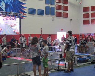 Neighbors | Alexis Bartolomucci.The crew and audience watched as the robotics team battled their robots against each other on Sept. 25 at Austintown Middle School during the FIRST Robotics competition.