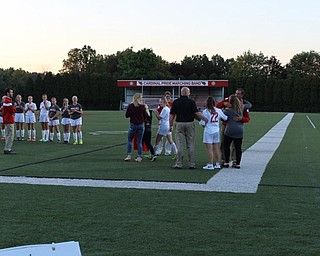 Neighbors | Abby Slanker.With the Canfield High School girls soccer team lined up beside them, Head Coach Phil Simone, Girls Assistant Coach Aleesha Ostrander and Girls Assistant Coach Chris Sekman greeted the senior team members and their parents and families during Senior Night on Oct. 5.