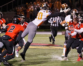 MICHAEL G TAYLOR | THE VINDICATOR- 10-21-16- 1st qtr, Howland's #20 recoveries his fumble on the game's initial kickoff. Howland Tigers vs Canfield Cardinals at Bob Dove Field in Canfield, OH.