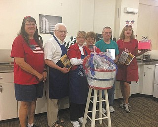 SPECIAL TO THE VINDICATOR
The Recipes of Youngstown group on Facebook, which has 9,000 members, is hosting a fall tasting event to honor Armed Forces and celebrate Veterans Day. Members shown with a wine raffle basket, from left, are Bobby Chalky, Keith Evans, Bobbie Allen, Patty Ruby, Donnie Allen and Linda Braunstein. The event, “Food from the Homefront” will take place from noon to 4 p.m. Nov. 5 at the Tyler History Center, 325 W. Federal St., downtown Youngstown. More than 30 family dishes will be prepared by bakers whose recipes are in the “Recipes of Youngstown” cookbook. The event is a joint fundraiser for the Mahoning Valley Historical Society and the Youngstown State University Armed Forces Student Association, which supports emergency needs for veteran students. Admission is free, and tasting tickets are six for $5. Raffle baskets also will be available. Parking is available in the westside lot. For information visit www.mahoninghistory.org or call 330-743-2589. 