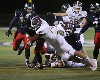 Boardman's Travis Koontz (10) hits Austintown Fitch quarterback Nate Fowler causing a fumble during the first quarter of Friday nights matchup at Fitch High School.   Dustin Livesay  |  The Vindicator  10/21/16  Austintown.
