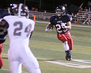 Austintown Fitch running back Randy Smith (25) picks up a block on Boardman's Matt Hillard (24) during the second quarter of Friday nights matchup at Fitch High School.   Dustin Livesay  |  The Vindicator  10/21/16  Austintown.