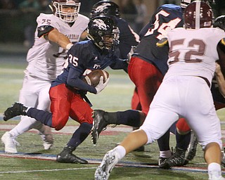 Austintown's Marquis Barbel (35) cuts through the Boardman defense during the third quarter of Friday nights matchup at Fitch High School.   Dustin Livesay  |  The Vindicator  10/21/16  Austintown.