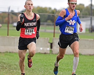 BAZETTA, OHIO - OCTOBER 22, 2016: Mike Shipman of Maplewood and Kenny Wallace of Mathews sprint to the finish line of the boy's Division 3 district cross country meet at the Trumbull Country Fairgrounds Saturday afternoon. DAVID DERMER | THE VINDICATOR