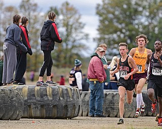 BAZETTA, OHIO - OCTOBER 22, 2016: Vincent Mauri of Howland and Chris Butler of Boardman sprint down the back stretch during the boy's Division 1 district cross country meet at the Trumbull Country Fairgrounds Saturday afternoon. DAVID DERMER | THE VINDICATOR