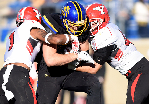 SDSU's Dallas Goedert is taken down by Youngstown's Eric Thompson (left) and Armand Dellovade during their game at Dana J. Dykhouse Stadium on Saturday