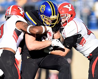 SDSU's Dallas Goedert is taken down by Youngstown's Eric Thompson (left) and Armand Dellovade during their game at Dana J. Dykhouse Stadium on Saturday