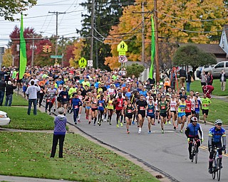 YOUNGSTOWN, OHIO - OCTOBER 23, 2016: Runners take off from the starting line on Kirk Road at the start of the Peace Race, Sunday morning. DAVID DERMER | THE VINDICATOR