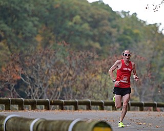 YOUNGSTOWN, OHIO - OCTOBER 23, 2016: Scott Mate runs on West Glacier Drive inside Mill Creek Park during the Peace Race, Sunday morning. DAVID DERMER | THE VINDICATOR