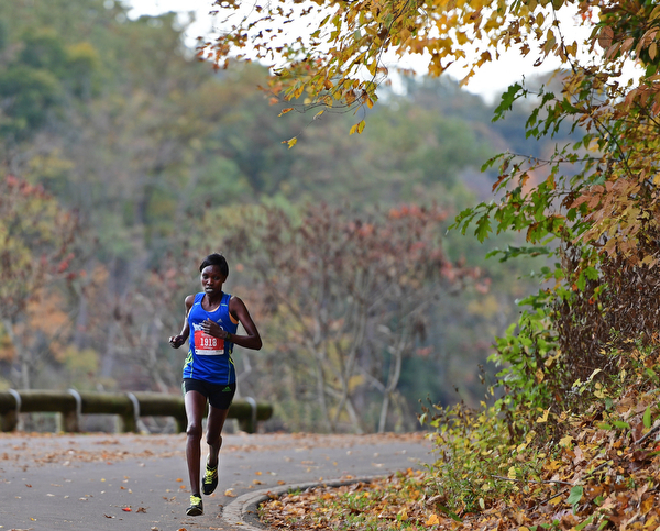 YOUNGSTOWN, OHIO - OCTOBER 23, 2016: Joan Aliyabei runs on West Glacier Drive inside Mill Creek Park during the Peace Race, Sunday morning. DAVID DERMER | THE VINDICATOR