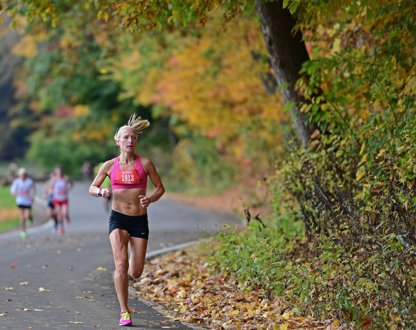 YOUNGSTOWN, OHIO - OCTOBER 23, 2016: Ellie Hess leads a pack of runners on West Glacier Drive inside Mill Creek Park during the Peace Race, Sunday morning. DAVID DERMER | THE VINDICATOR