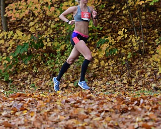 YOUNGSTOWN, OHIO - OCTOBER 23, 2016: Gabriella Kruez runs on West Glacier Drive inside Mill Creek Park during the Peace Race, Sunday morning. DAVID DERMER | THE VINDICATOR