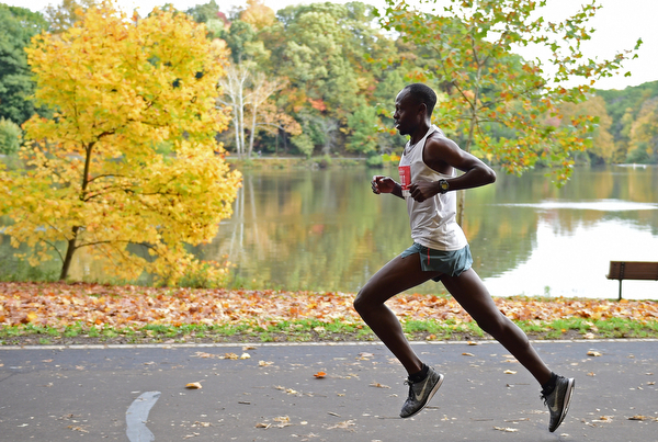 YOUNGSTOWN, OHIO - OCTOBER 23, 2016: James Kibet runs on West Glacier Drive inside Mill Creek Park during the Peace Race, Sunday morning. DAVID DERMER | THE VINDICATOR