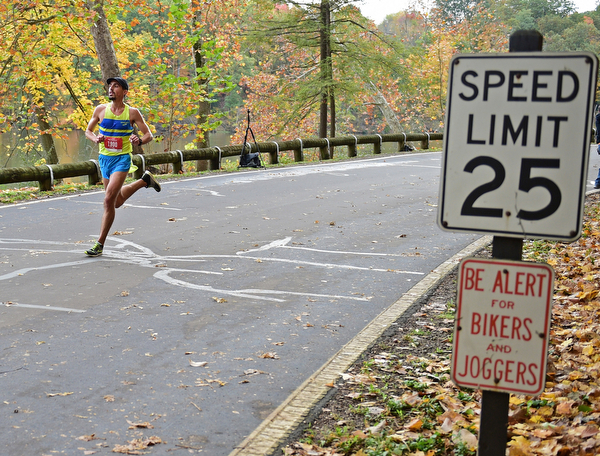 YOUNGSTOWN, OHIO - OCTOBER 23, 2016: John Raneri runs on West Glacier Drive inside Mill Creek Park during the Peace Race, Sunday morning. DAVID DERMER | THE VINDICATOR