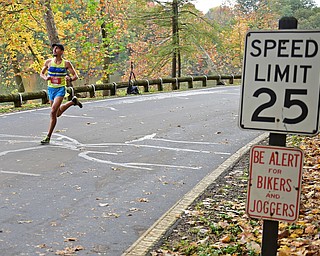 YOUNGSTOWN, OHIO - OCTOBER 23, 2016: John Raneri runs on West Glacier Drive inside Mill Creek Park during the Peace Race, Sunday morning. DAVID DERMER | THE VINDICATOR