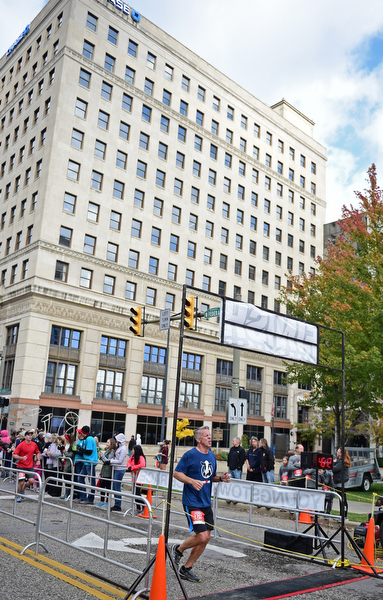 YOUNGSTOWN, OHIO - OCTOBER 23, 2016: Michael Rosteck of Canfield crosses the finish line on West Federal Street during the Peace Race, Sunday morning. DAVID DERMER | THE VINDICATOR