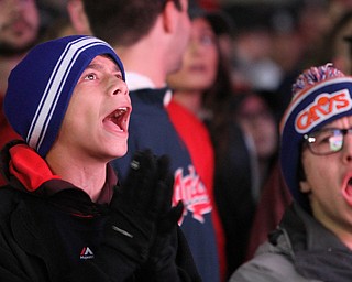 Nikos Frazier | The Vindicator..Fans cheer during the first inning while watching the Indians take on the Cubs between the Quicken Loans Arena and Progressive Field as the on Tuesday, Oct. 25, 2016.