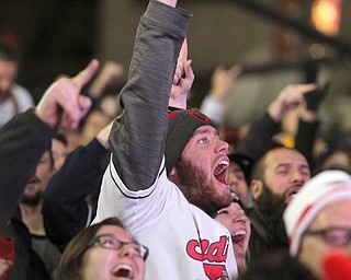 Nikos Frazier | The Vindicator..Fans cheer during the first inning while watching the Indians take on the Cubs between the Quicken Loans Arena and Progressive Field as the on Tuesday, Oct. 25, 2016.
