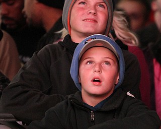 Nikos Frazier | The Vindicator..Tyler(top), 13, and Oliver Miller, 11, of Uniontown watch the Indians take on the Cubs between the Quicken Loans Arena and Progressive Field as the on Tuesday, Oct. 25, 2016.