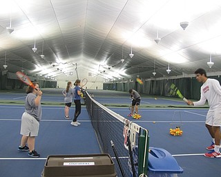 Neighbors | Alexis Bartolomucci.Youngstown State University tennis players played tennis with the athletes who have down syndrome on Sept. 24 at the Boardman Tennis Center for the Buddy Up Tennis program.