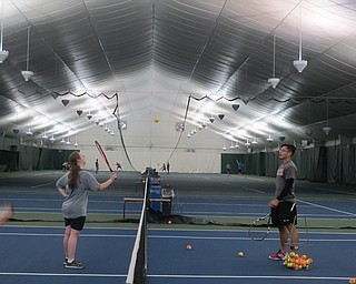 Neighbors | Alexis Bartolomucci.A Youngstown State tennis buddy played with one of the athletes of the Buddy Up Tennis program on Sept. 24 at the Boardman Tennis Center.
