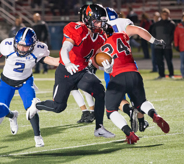 MICHAEL G TAYLOR | THE VINDICATOR- 10-28-16- 2nd qtr, Canfield's #4 Paul Breinz takes the ball from the 7 yard line of Poland into the endzone for the TD. Poland Bulldogs vs Canfield Cardinals at Bob Dove Field in Canfield, OH.
