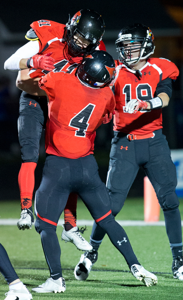 MICHAEL G TAYLOR | THE VINDICATOR- 10-28-16- 2nd qtr, Canfield's #41 Matt Zaremski celebrates with his teammates after he scored on a 40 yard td pass. Poland Bulldogs vs Canfield Cardinals at Bob Dove Field in Canfield, OH.