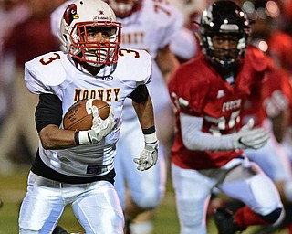AUSTINTOWN, OHIO - OCTOBER 28, 2016: Chris Gruber #3 of Mooney runs away fro Marquis Barbel #35 of Fitch and into the end zone to score a touchdown during the first half of their game Friday night at Fitch High School. DAVID DERMER | THE VINDICATOR