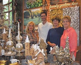 SPECIAL TO THE VINDICATOR
Seasonal decor and other items are featured in the Shop in the Gardens at Fellows Riverside Gardens, where a Holiday Open House is planned this week. In the shop, from left, are Jeanne Simeone, buyer for the shop; Paul Hagman, Friends of Fellows Riverside Gardens president; Janet Yaniglos, Friends vice president; and Eileen Stankovich, shop manager.