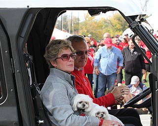 Nikos Frazier | The Vindicator..YSU President Jim Tressel(right), his wife Ellen Tressel and their dogs at the 2016 Youngstown State University Homecoming on Saturday, Oct. 29, 2016.