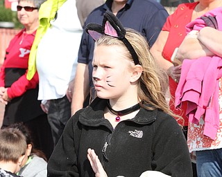 Nikos Frazier | The Vindicator..Jersey Huff, 9, of Youngstown watches the 2016 Youngstown State University Homecoming on Saturday, Oct. 29, 2016.
