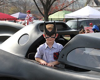Nikos Frazier | The Vindicator..A young batman looks out of the bat-mobile at the 2016 Youngstown State University Homecoming on Saturday, Oct. 29, 2016.