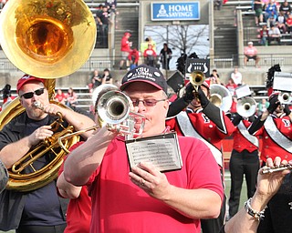 Nikos Frazier | The Vindicator..Michael Sperague, YSU Class of 88, plays with the YSU Marching Band at the 2016 Youngstown State University Homecoming on Saturday, Oct. 29, 2016.