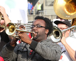Nikos Frazier | The Vindicator..Jamal "SJ" Fareed, YSU Class of 2014, plays with the YSU Marching Band at the 2016 Youngstown State University Homecoming on Saturday, Oct. 29, 2016.