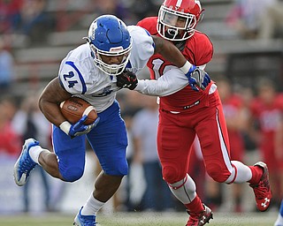 YOUNGSTOWN, OHIO - OCTOBER 29, 2016: Roland Genesy #24 of Indiana State is brought down by Jeremiah Braswell #16 of YSU during the first half of their game Saturday afternoon at Stambaugh Stadium. YSU 13-10. DAVID DERMER | THE VINDICATOR