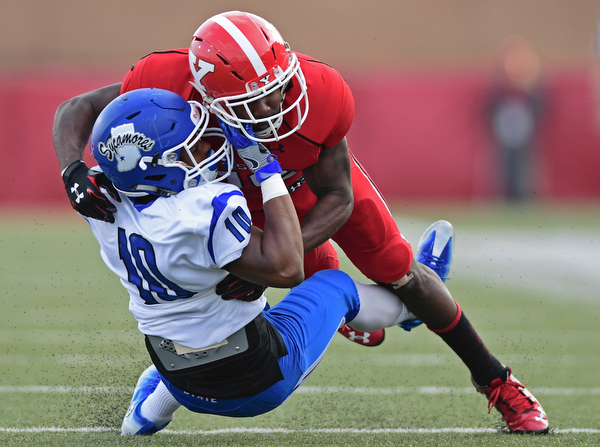 YOUNGSTOWN, OHIO - OCTOBER 29, 2016: Jameel Smith #26 of YSU brings down Kelvin Cook #10 of Indiana State during the first half of their game Saturday afternoon at Stambaugh Stadium. YSU 13-10. DAVID DERMER | THE VINDICATOR