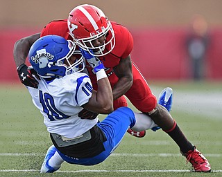 YOUNGSTOWN, OHIO - OCTOBER 29, 2016: Jameel Smith #26 of YSU brings down Kelvin Cook #10 of Indiana State during the first half of their game Saturday afternoon at Stambaugh Stadium. YSU 13-10. DAVID DERMER | THE VINDICATOR