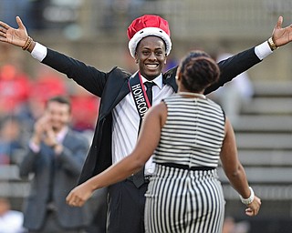YOUNGSTOWN, OHIO - OCTOBER 29, 2016: YSU student and Homecoming King Kyle Moore smiles while waiting to hug Homecoming Queen Rachel Davis during halftime of Saturday afternoons game between Youngstown State and Indiana State at Stambaugh Stadium. DAVID DERMER | THE VINDICATOR