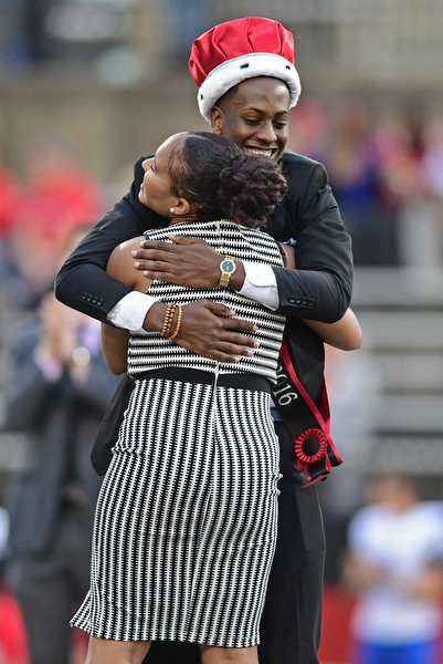 YOUNGSTOWN, OHIO - OCTOBER 29, 2016: YSU student and Homecoming King Kyle Moore hugs Homecoming Queen Rachel Davis during halftime of Saturday afternoons game between Youngstown State and Indiana State at Stambaugh Stadium. DAVID DERMER | THE VINDICATOR