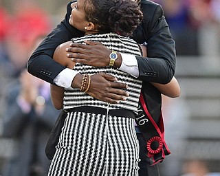 YOUNGSTOWN, OHIO - OCTOBER 29, 2016: YSU student and Homecoming King Kyle Moore hugs Homecoming Queen Rachel Davis during halftime of Saturday afternoons game between Youngstown State and Indiana State at Stambaugh Stadium. DAVID DERMER | THE VINDICATOR