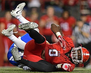 YOUNGSTOWN, OHIO - OCTOBER 29, 2016: Avery Moss #9 of YSU celebrates on the turf after sacking Isaac Harker #14 of Indiana State during the second half of their game Saturday afternoon at Stambaugh Stadium. YSU 13-10. DAVID DERMER | THE VINDICATOR