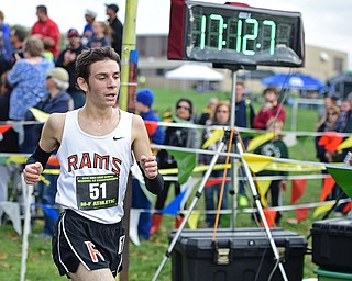 BOARDMAN, OHIO - OCTOBER 29, 2016: Palmer Cameron of Mineral Ridge finishes the Division 3 Northeast Ohio Regional Cross Country race at Boardman High School. DAVID DERMER | THE VINDICATOR