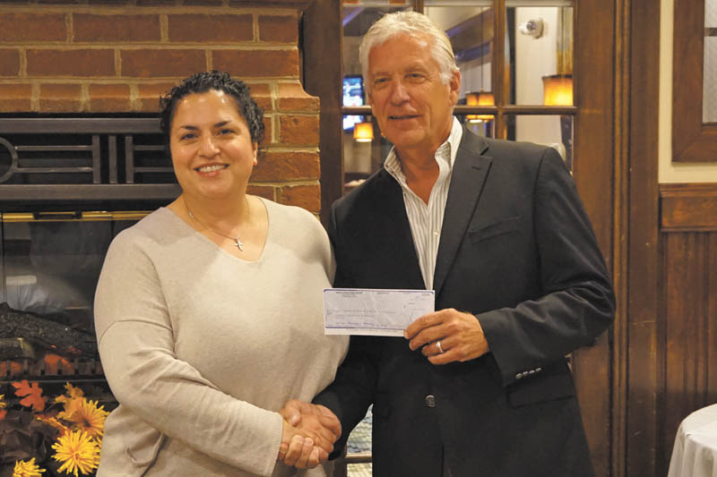 SPECIAL TO THE VINDICATOR
The Diabetes Partnership of the Mahoning Valley received $15,109.44 from the Ankle and Foot Care Center’s 18th annual golf outing at Pine Lake Golf Course in Hubbard. Dr. Michelle Anania of Ankle and Foot Care Centers, left, presented the check to Ed Hassay, president of the DPMV. Ankle and Foot Care Center is a major sponsor of DPMV, which is a support group with recipients such as the Midlothian Free Health Clinic’s diabetes program and the Jean Rider Scholarship Fund. DPMV is run with only volunteers, and funds are administered by the Community Foundation of the Mahoning Valley.
